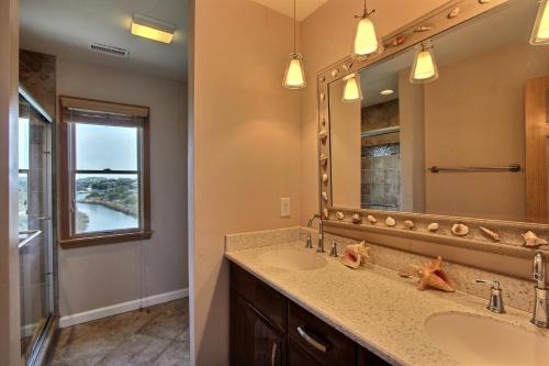 a bathroom with a sink and a mirror at Knock Out #3-MC in Avon