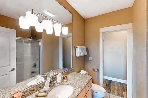 a bathroom with a sink and a mirror at Oceanfront Contemporary in Lincoln City