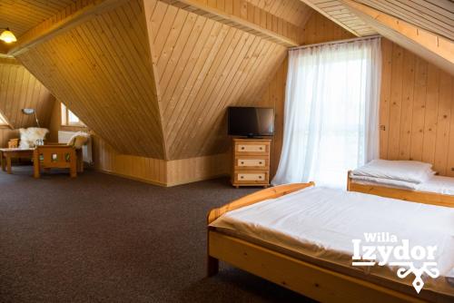 Ein Bett oder Betten in einem Zimmer der Unterkunft Willa Izydor, widok na Tatry, pyszne posiłki