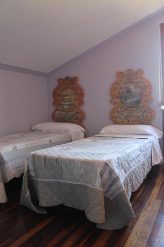 Postel nebo postele na pokoji v ubytování Casa Arezzola