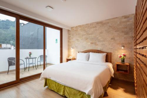 Postel nebo postele na pokoji v ubytování Casa del Balcon