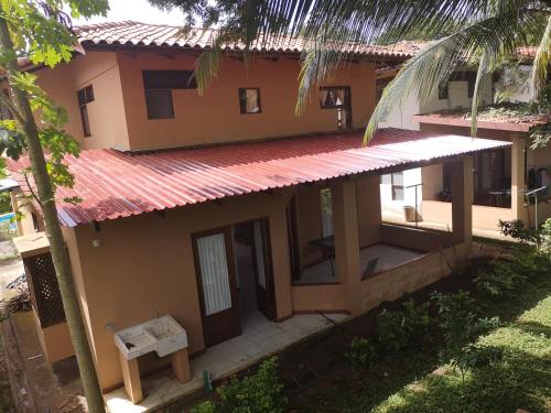 an aerial view of a house with a palm tree at Condominio Villa Hermosa in Playa Hermosa