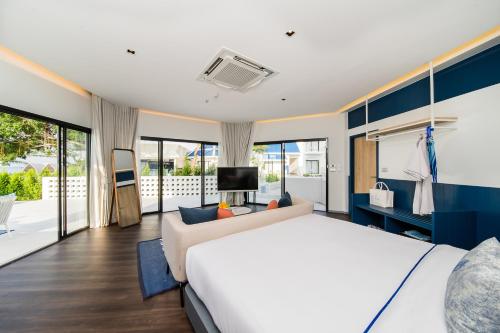 Postel nebo postele na pokoji v ubytování Kram Pattaya