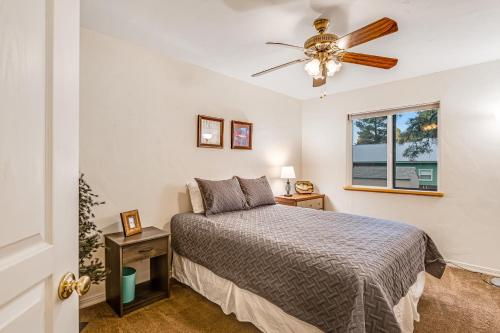 a bedroom with a bed and a ceiling fan at The Lakeview Escape in Pagosa Springs