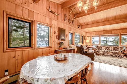 a living room with a table and a couch at Sound Serenity in Orcas