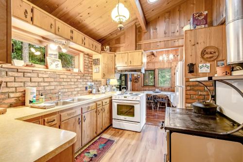 a large kitchen with wooden cabinets and white appliances at Sound Serenity in Orcas
