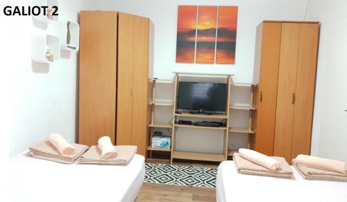Postel nebo postele na pokoji v ubytování Apartmani Galiot