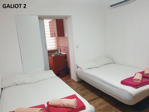 Apartmani Galiotにあるベッド