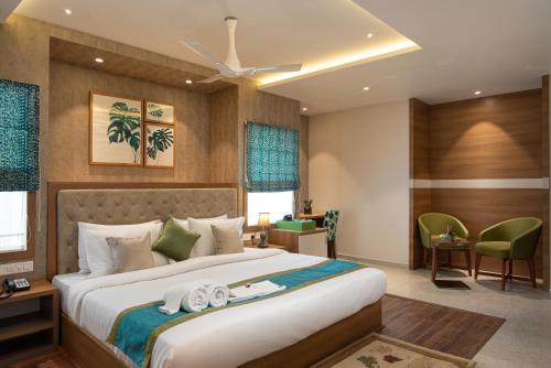a bedroom with a large bed in a room at Time Square Boutique Hotel & Spa in Alleppey