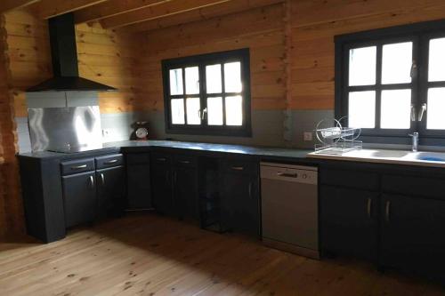 A kitchen or kitchenette at Chalet Bois Laruns