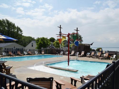 a pool at a resort with tables and chairs at South Beach Resort Hotel in Marblehead