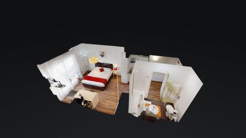 a model of a room with a bed and a couch at Alezan Hôtel & Résidence in Toulouse