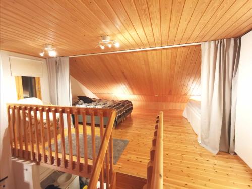 a room with a sauna with a wooden ceiling at Gold Legend Paukkula #1 - Saariselkä Apartments in Saariselka
