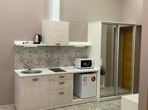 Kjøkken eller kjøkkenkrok på Heart Kyiv Apart-Hotel