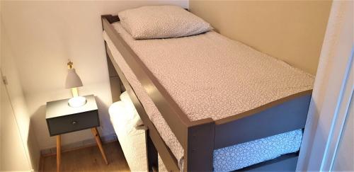 Ένα ή περισσότερα κρεβάτια σε δωμάτιο στο Appart Bréti Plage 1 - avec parking