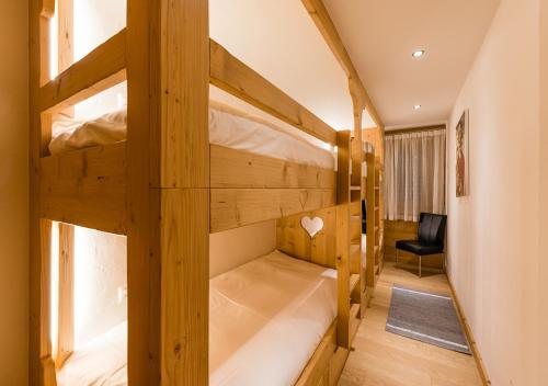 a couple of bunk beds in a room at Nendaz 4 Vallées & SPA 4* Superior in Nendaz