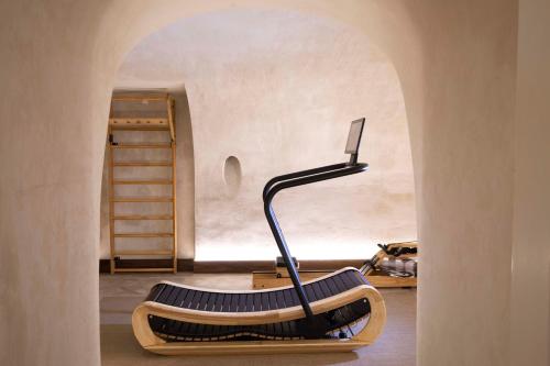 a treadmill in a room with an archway at Philéas Lazare & Spa in Paris