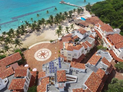 an aerial view of a house on the beach at 3BR Apt @CadaquesCaribe Bayahibe in San Rafael del Yuma
