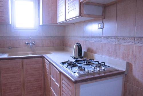 Nhà bếp/bếp nhỏ tại شقق لمسات الخير