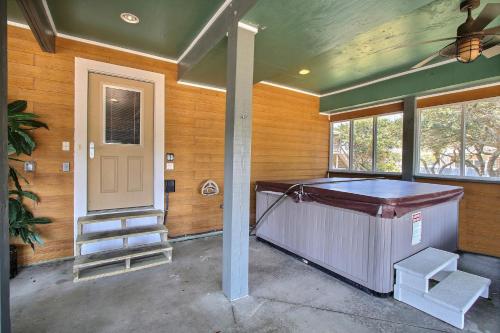 a house with a hot tub in a room with a door at The Love Boat #15SV-F in Frisco