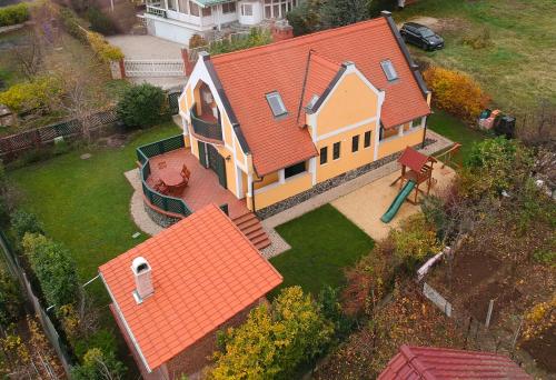 an overhead view of a house with an orange roof at Bed & Badacsony in Badacsonytördemic