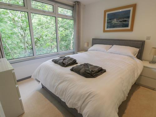 a bedroom with a large bed with two pillows on it at The River Lodge in Oban