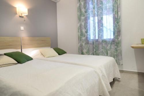 Postel nebo postele na pokoji v ubytování Calma apartment