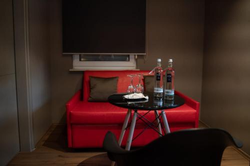 Ein Sitzbereich in der Unterkunft Zum grünen Baum Hotel Frankfurt Airport