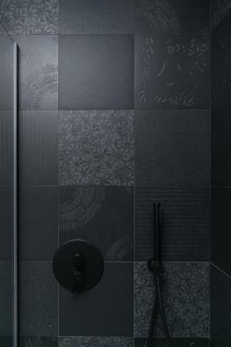 a shower with a glass door in a bathroom at WeLive in Carpi