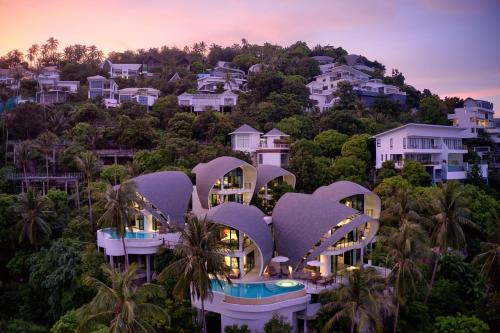 arial view of a resort on a hill with houses at Villa The Spot Koh Samui in Chaweng Noi Beach