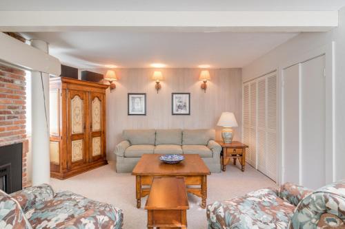 a living room with a couch and a table at Prospector 204 in Ketchum