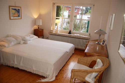 Кровать или кровати в номере Haus Rothenstein, ruhige FeWo, ca. 10 min. zu Messe und Flughafen