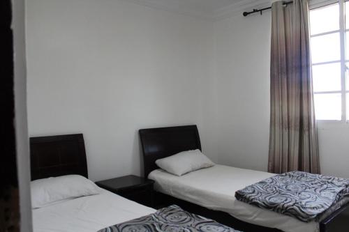 Postel nebo postele na pokoji v ubytování Residence Nadra