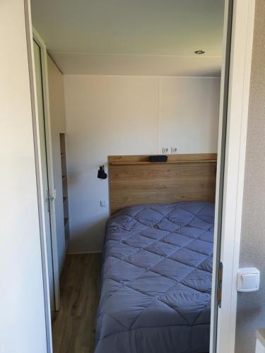 Llit o llits en una habitació de MOBIL-HOME OHARA 2020
