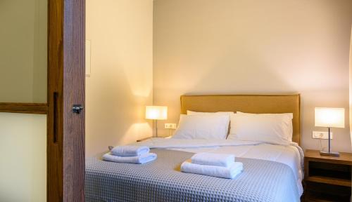 Ένα ή περισσότερα κρεβάτια σε δωμάτιο στο Elounda Colour Apartments