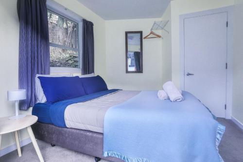 Säng eller sängar i ett rum på Aspen Lodge Backpackers