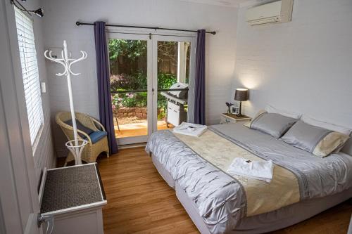 Ένα ή περισσότερα κρεβάτια σε δωμάτιο στο Homewood Cottages