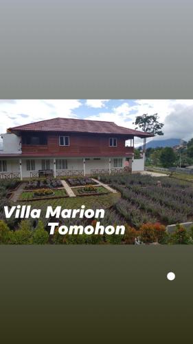 a building with a sign that reads villa nation tumor at Super Wonderful 5 bedrooms with Bathroom Villa Marion Tomohon in Tomohon