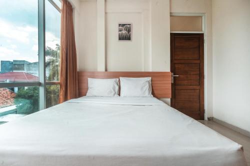 Posteľ alebo postele v izbe v ubytovaní The Kartini 8 Residence - Mangga Besar