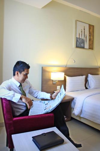 Katil atau katil-katil dalam bilik di Biz Hotel Batam