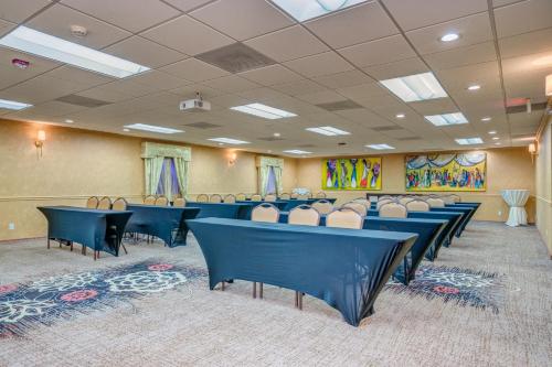 a conference room with blue tables and chairs at Clarion Inn in Sierra Vista