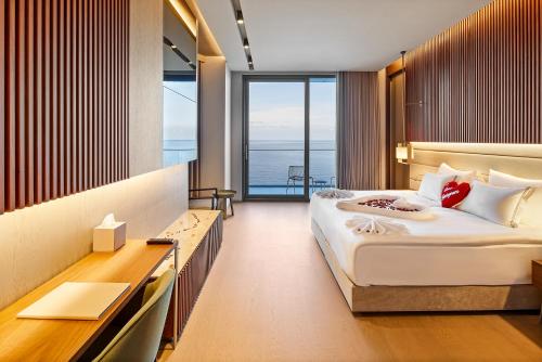 Katil atau katil-katil dalam bilik di Ricosta Hotel