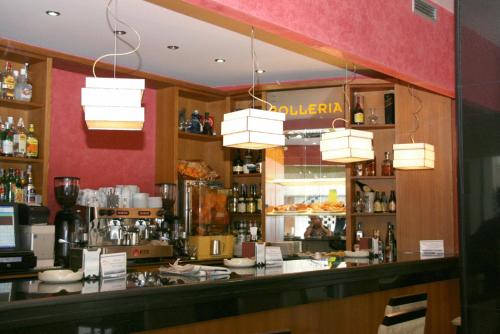 a bar in a restaurant with a counter at Hotel HHB Pontevedra Confort in Pontevedra