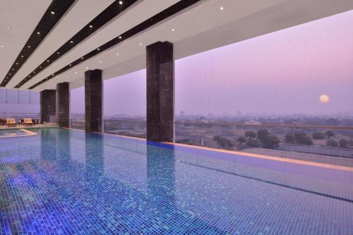 a swimming pool on the roof of a building at Taj Skyline Ahmedabad in Ahmedabad
