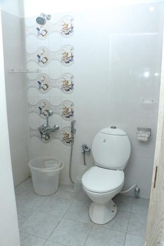 A bathroom at Swarna Sudarshan Service Apartment @ Adyar chennai