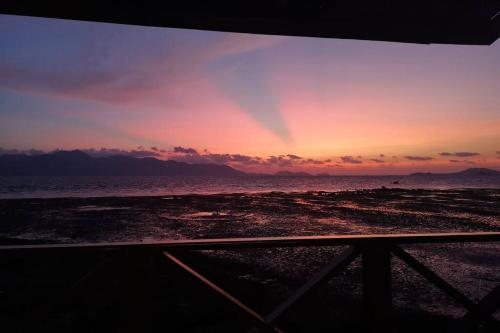a view of the ocean from a boat at sunset at Ocean front 2br 107sqm house - Panorama Sea View in Laem Ngop