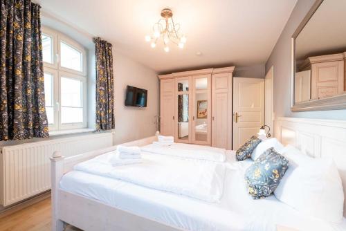 Ein Bett oder Betten in einem Zimmer der Unterkunft Haus auf dem Hügel - Appartement 2