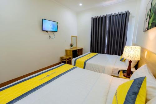 Ein Bett oder Betten in einem Zimmer der Unterkunft Hanah Hotel