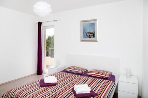 Ліжко або ліжка в номері Apartment Sasso