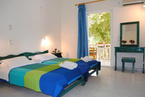 Posteľ alebo postele v izbe v ubytovaní Kuris Studios & Apartments